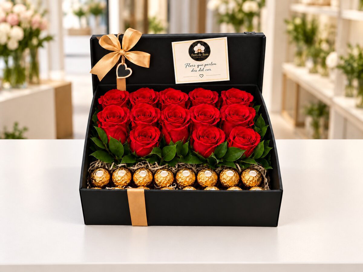 Caixa negra amb roses vermelles i bombons sobre el taulell de la botiga